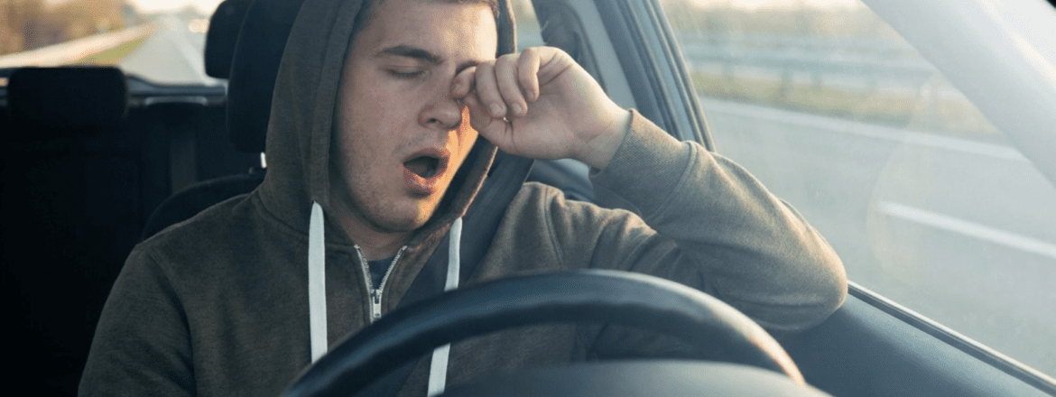 Drowsy, Young Driver Behind the Wheel